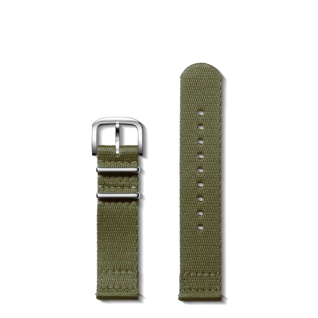 The Shinola 20mm Khaki G10 Nylon Watch Strap is shown in two pieces with a silver buckle on a white background. It features classic edge stitching and multiple adjustment holes for a comfortable fit.