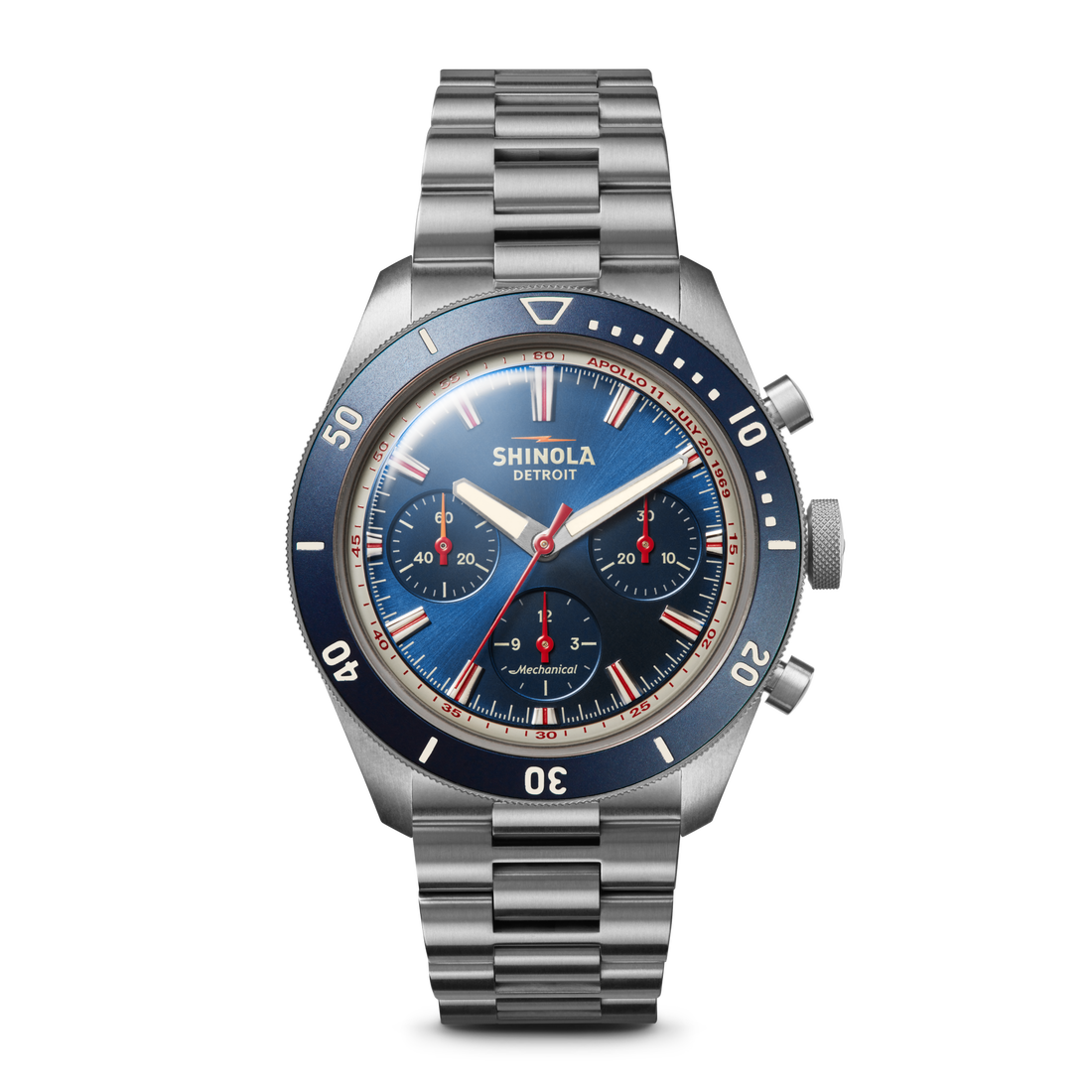 The Shinola Mooncraft Monster Chronograph Watch - Sea Blue features a stainless steel case, blue face and bezel, silver hour markers, two subdials, and a metal link bracelet—showcasing Detroit craftsmanship on a white background.