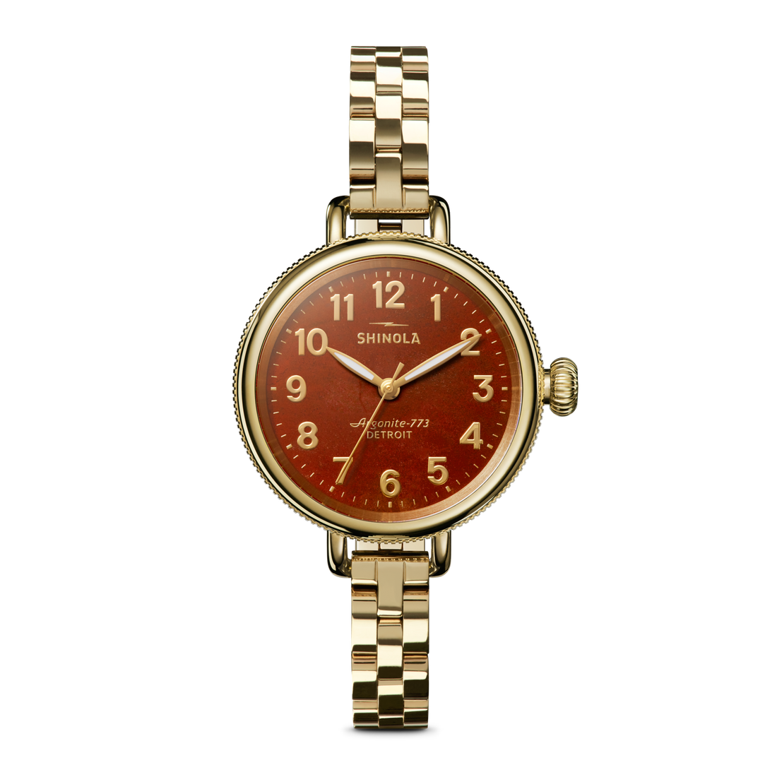 The Shinola Birdy Watch - Red Jasper features a gold PVD case, round red gradient dial reading "Shinola" and "Argonite-773 Detroit," gold numerals and hands, and a gold metal link band for a distinctive look.