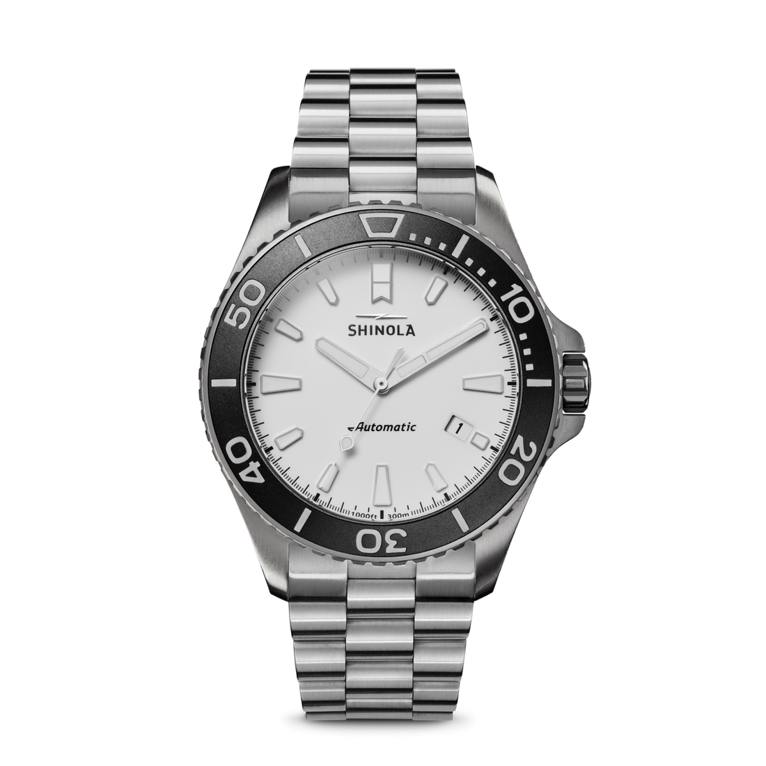 The Shinola Ice Monster Automatic Watch - White features a stainless steel case, silver metal band, white dial, black bezel, bold hour markers, and automatic movement. The face displays "SHINOLA.
