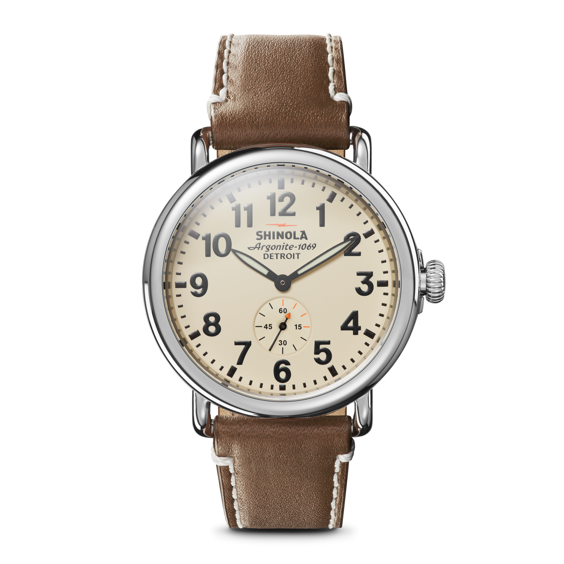 The Shinola Runwell Watch - Cream features an Argonite 1069 movement, beige dial, bold black numerals, small seconds subdial above 6 o’clock, brown leather strap, and stainless steel case against a white background.
