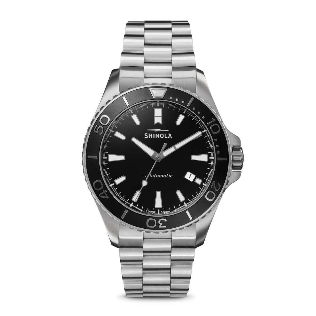 The Shinola Lake Superior Monster Automatic Watch features a glossy black dial with bold white hour markers, silver hands, and a stainless steel link bracelet. Minute indicators decorate the bezel, with "Automatic" above the 6 o’clock position.